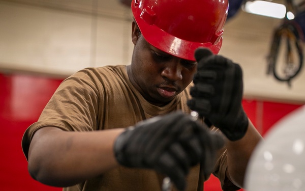 USS Tripoli Sailors Assemble Ordnance