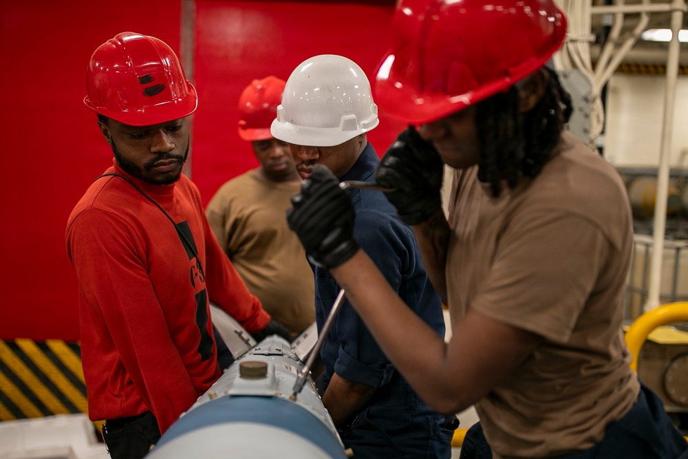 USS Tripoli Sailors Assemble Ordnance