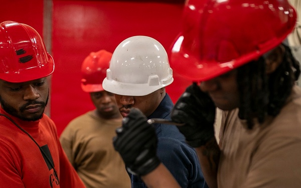 USS Tripoli Sailors Assemble Ordnance