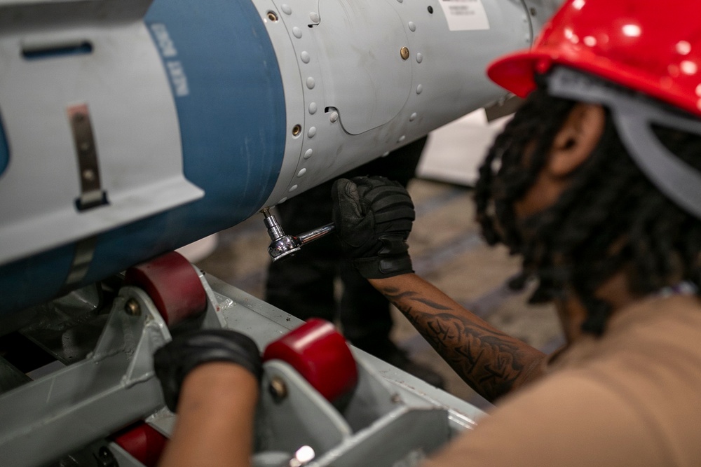 USS Tripoli Sailors Assemble Ordnance