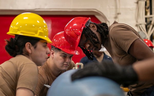 USS Tripoli Sailors Assemble Ordnance