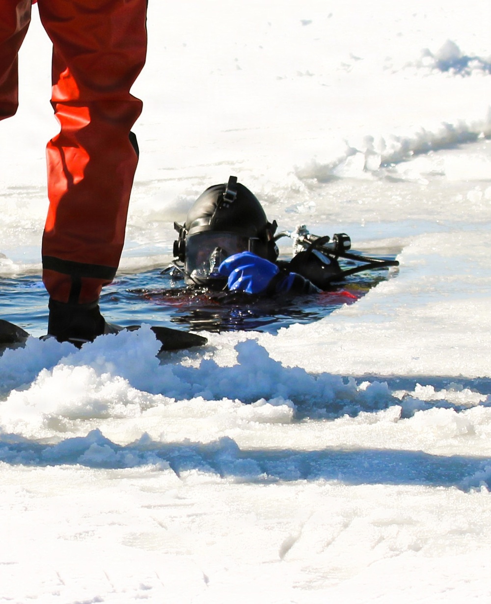 Fort McCoy firefighters practice diving under ice at post’s Big Sandy Lake during February 2026 training