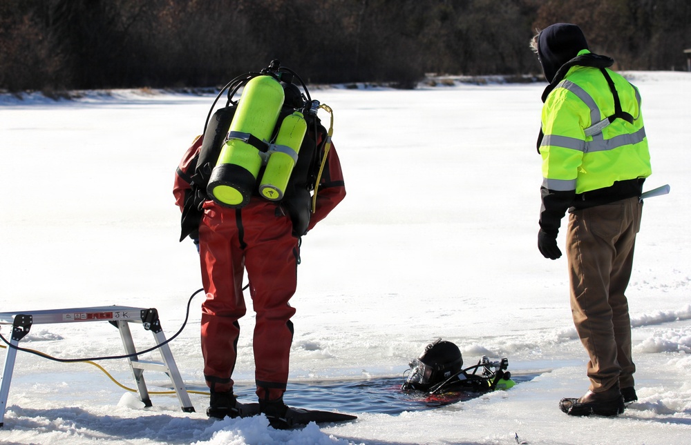 Fort McCoy firefighters practice diving under ice at post’s Big Sandy Lake during February 2026 training