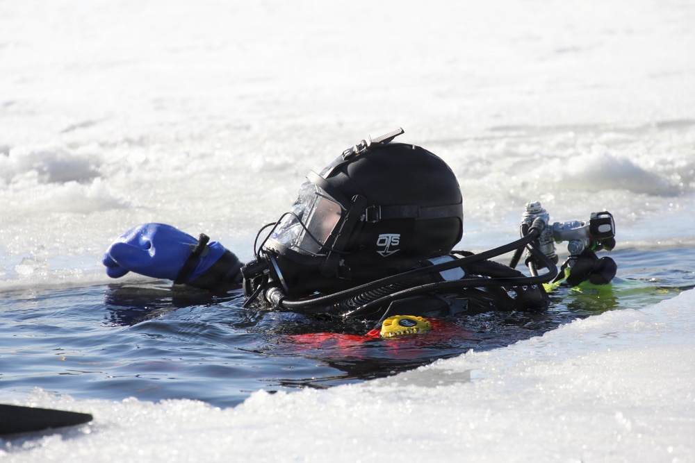 Fort McCoy firefighters practice diving under ice at post’s Big Sandy Lake during February 2026 training