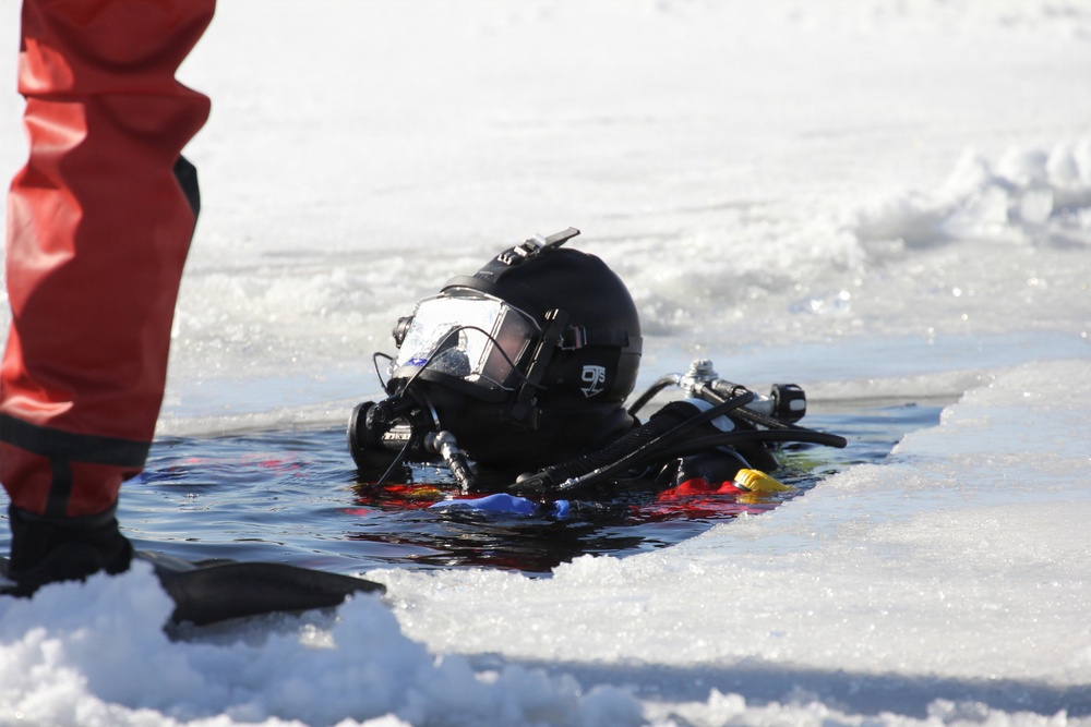 Fort McCoy firefighters practice diving under ice at post’s Big Sandy Lake during February 2026 training