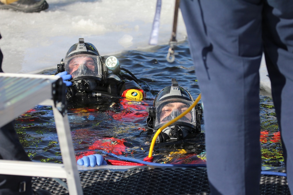 Fort McCoy firefighters practice diving under ice at post’s Big Sandy Lake during February 2026 training