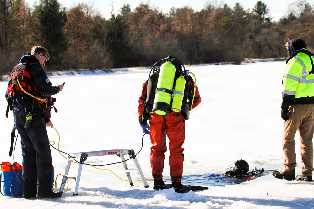 Fort McCoy firefighters practice diving under ice at post’s Big Sandy Lake during February 2026 training