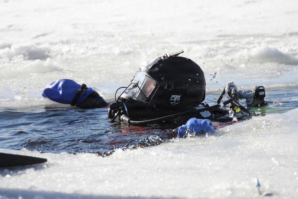 Fort McCoy firefighters practice diving under ice at post’s Big Sandy Lake during February 2026 training