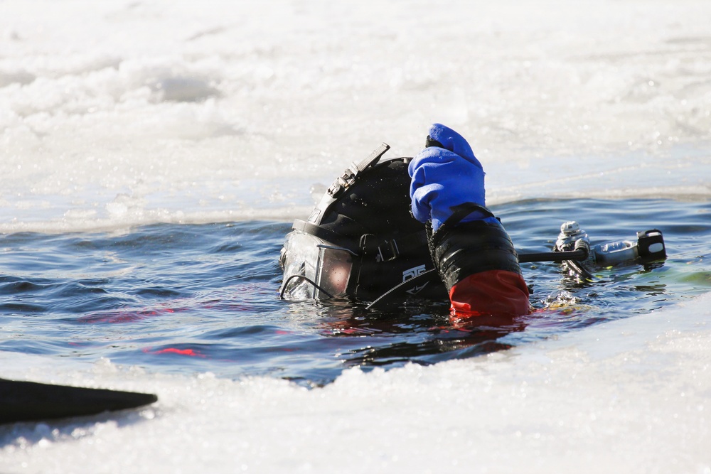 Fort McCoy firefighters practice diving under ice at post’s Big Sandy Lake during February 2026 training