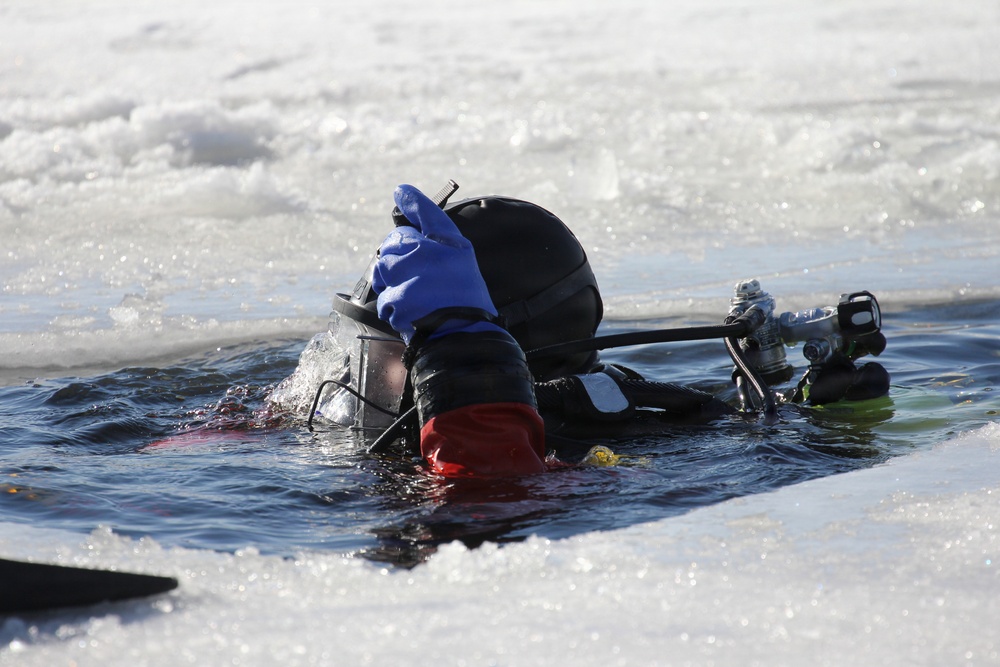 Fort McCoy firefighters practice diving under ice at post’s Big Sandy Lake during February 2026 training