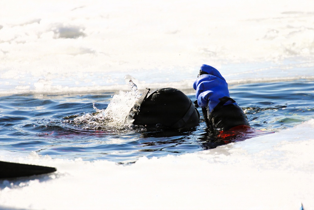 Fort McCoy firefighters practice diving under ice at post’s Big Sandy Lake during February 2026 training