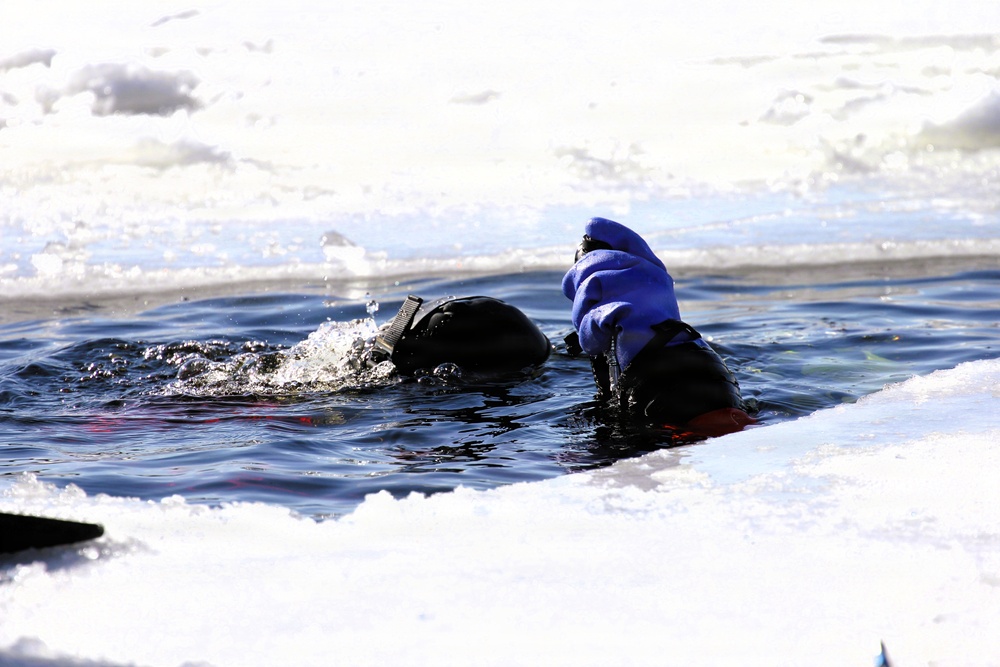 Fort McCoy firefighters practice diving under ice at post’s Big Sandy Lake during February 2026 training