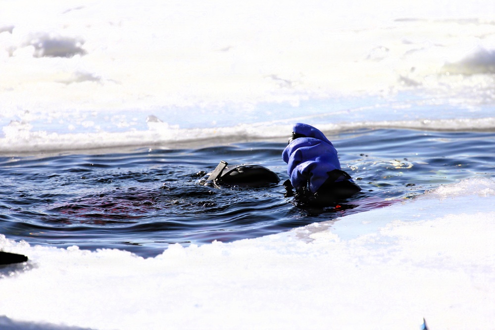 Fort McCoy firefighters practice diving under ice at post’s Big Sandy Lake during February 2026 training