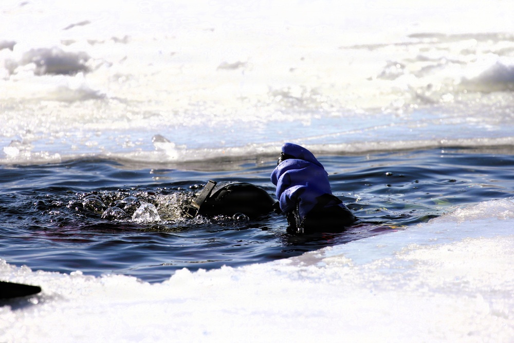 Fort McCoy firefighters practice diving under ice at post’s Big Sandy Lake during February 2026 training