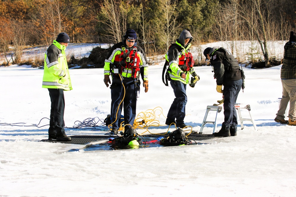 Fort McCoy firefighters practice diving under ice at post’s Big Sandy Lake during February 2026 training