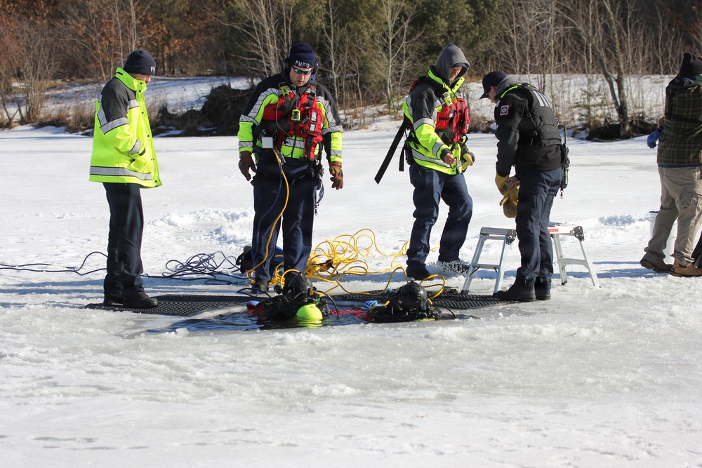 Fort McCoy firefighters practice diving under ice at post’s Big Sandy Lake during February 2026 training