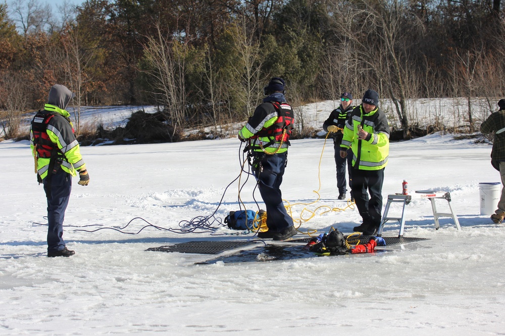 Fort McCoy firefighters practice diving under ice at post’s Big Sandy Lake during February 2026 training