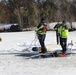 Fort McCoy firefighters practice diving under ice at post’s Big Sandy Lake during February 2026 training