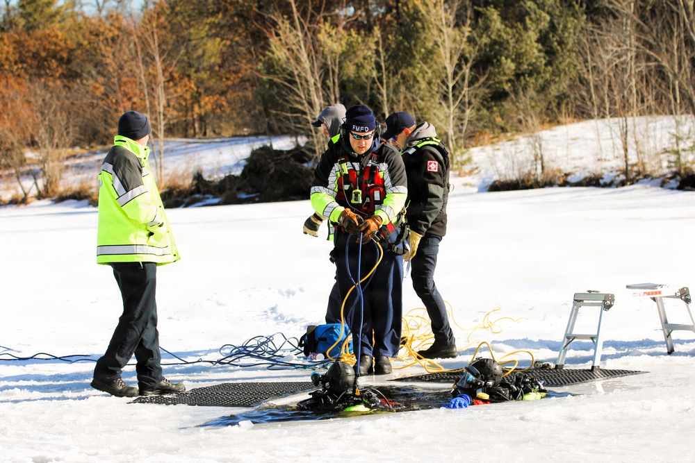 Fort McCoy firefighters practice diving under ice at post’s Big Sandy Lake during February 2026 training