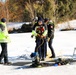 Fort McCoy firefighters practice diving under ice at post’s Big Sandy Lake during February 2026 training