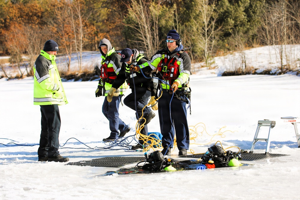 Fort McCoy firefighters practice diving under ice at post’s Big Sandy Lake during February 2026 training