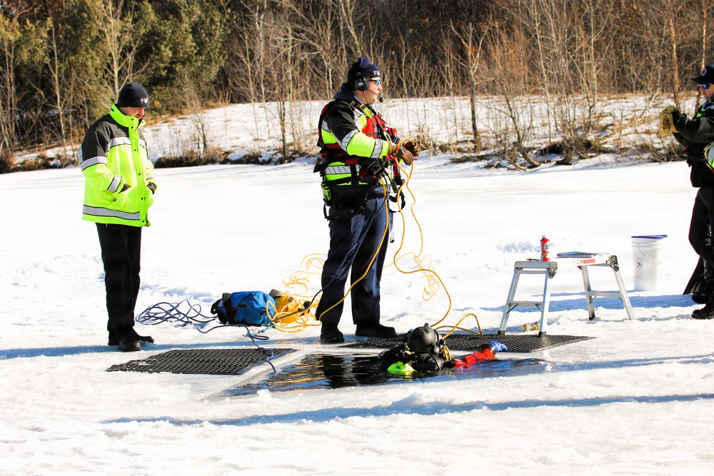 Fort McCoy firefighters practice diving under ice at post’s Big Sandy Lake during February 2026 training