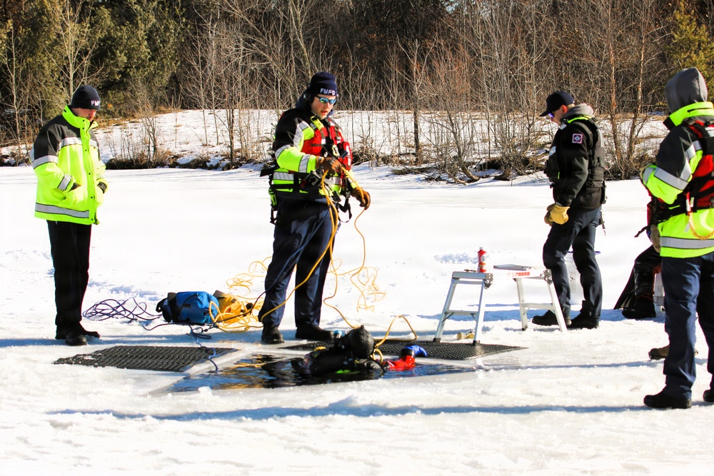 Fort McCoy firefighters practice diving under ice at post’s Big Sandy Lake during February 2026 training