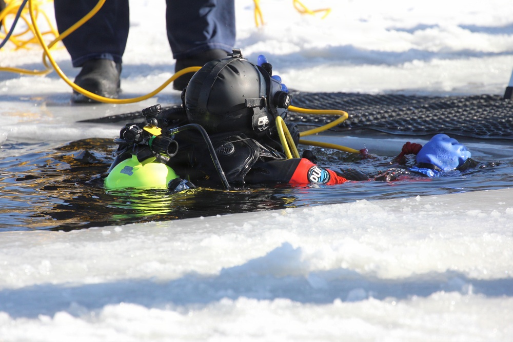 Fort McCoy firefighters practice diving under ice at post’s Big Sandy Lake during February 2026 training