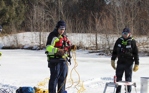 Fort McCoy firefighters practice diving under ice at post’s Big Sandy Lake during February 2026 training