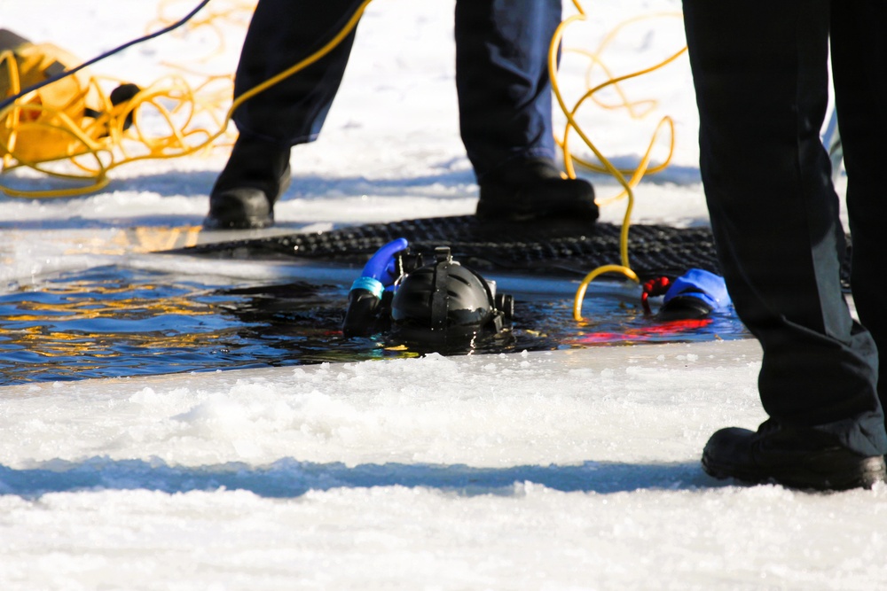 Fort McCoy firefighters practice diving under ice at post’s Big Sandy Lake during February 2026 training