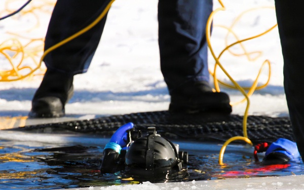 Fort McCoy firefighters practice diving under ice at post’s Big Sandy Lake during February 2026 training