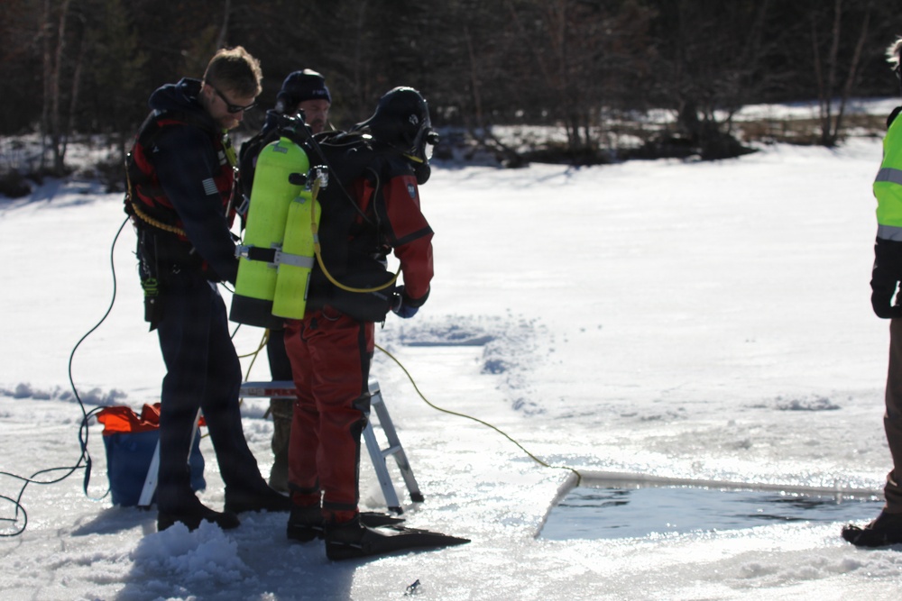 Fort McCoy firefighters practice diving under ice at post’s Big Sandy Lake during February 2026 training