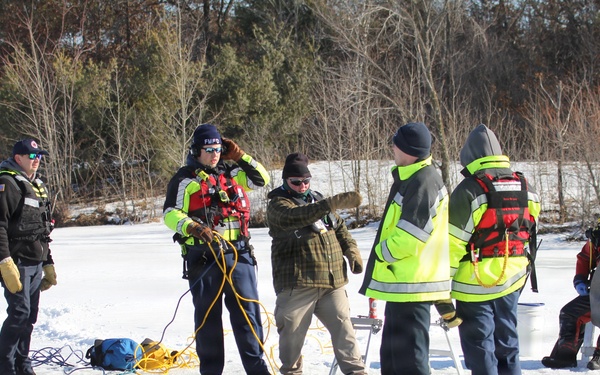 Fort McCoy firefighters practice diving under ice at post’s Big Sandy Lake during February 2026 training