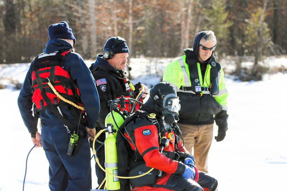 Fort McCoy firefighters practice diving under ice at post’s Big Sandy Lake during February 2026 training
