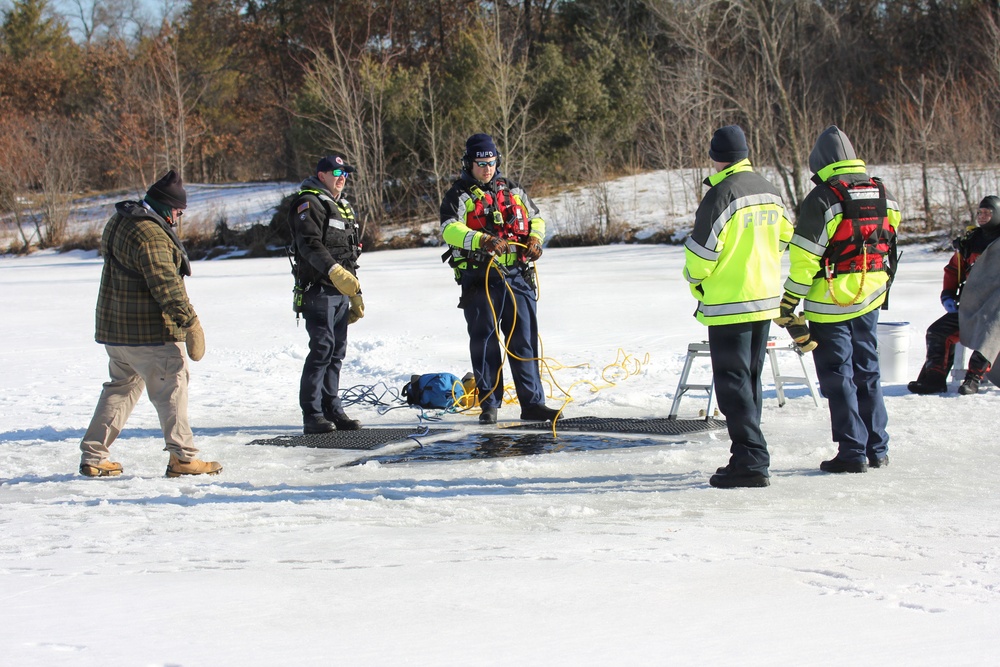 Fort McCoy firefighters practice diving under ice at post’s Big Sandy Lake during February 2026 training