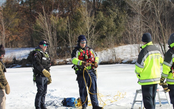 Fort McCoy firefighters practice diving under ice at post’s Big Sandy Lake during February 2026 training
