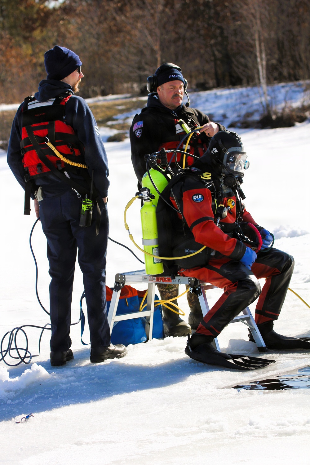 Fort McCoy firefighters practice diving under ice at post’s Big Sandy Lake during February 2026 training