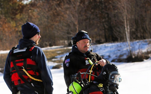 Fort McCoy firefighters practice diving under ice at post’s Big Sandy Lake during February 2026 training