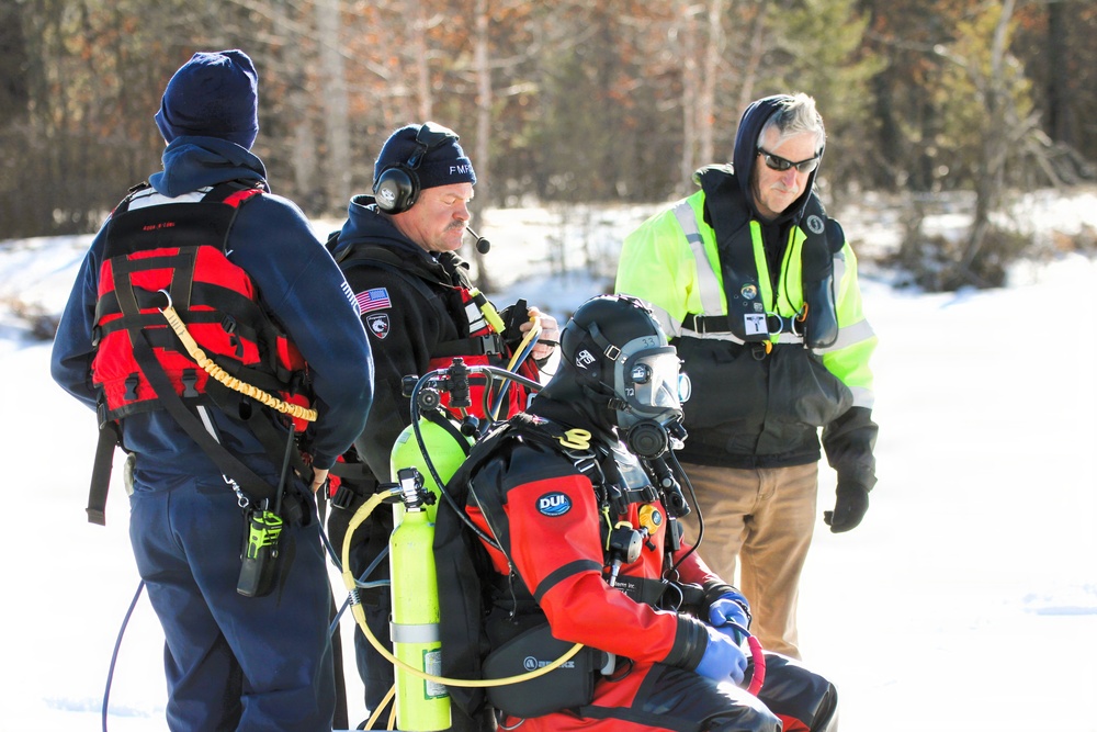 Fort McCoy firefighters practice diving under ice at post’s Big Sandy Lake during February 2026 training