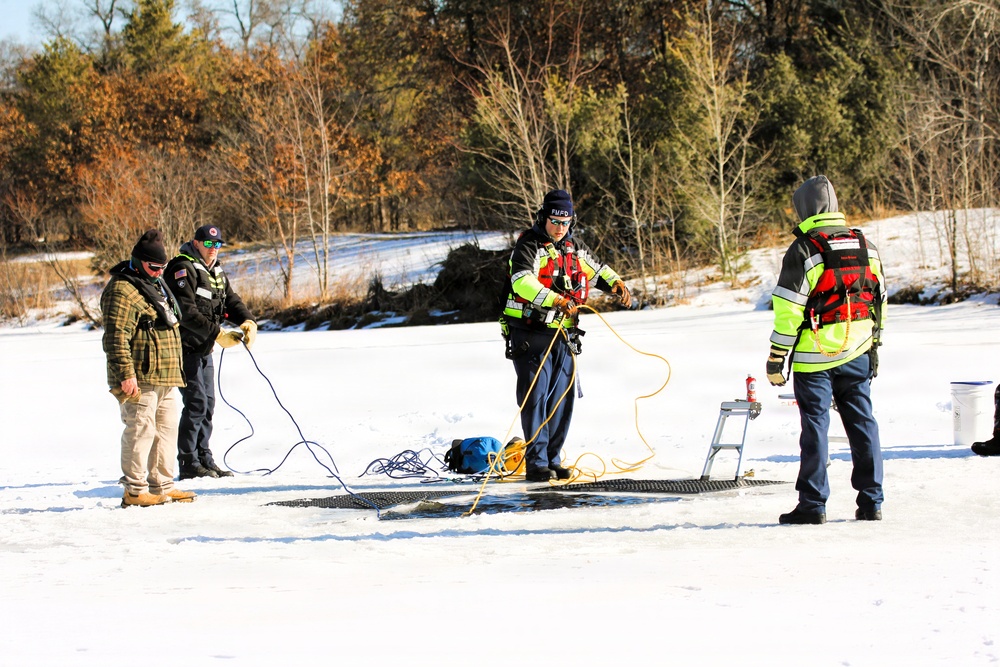 Fort McCoy firefighters practice diving under ice at post’s Big Sandy Lake during February 2026 training