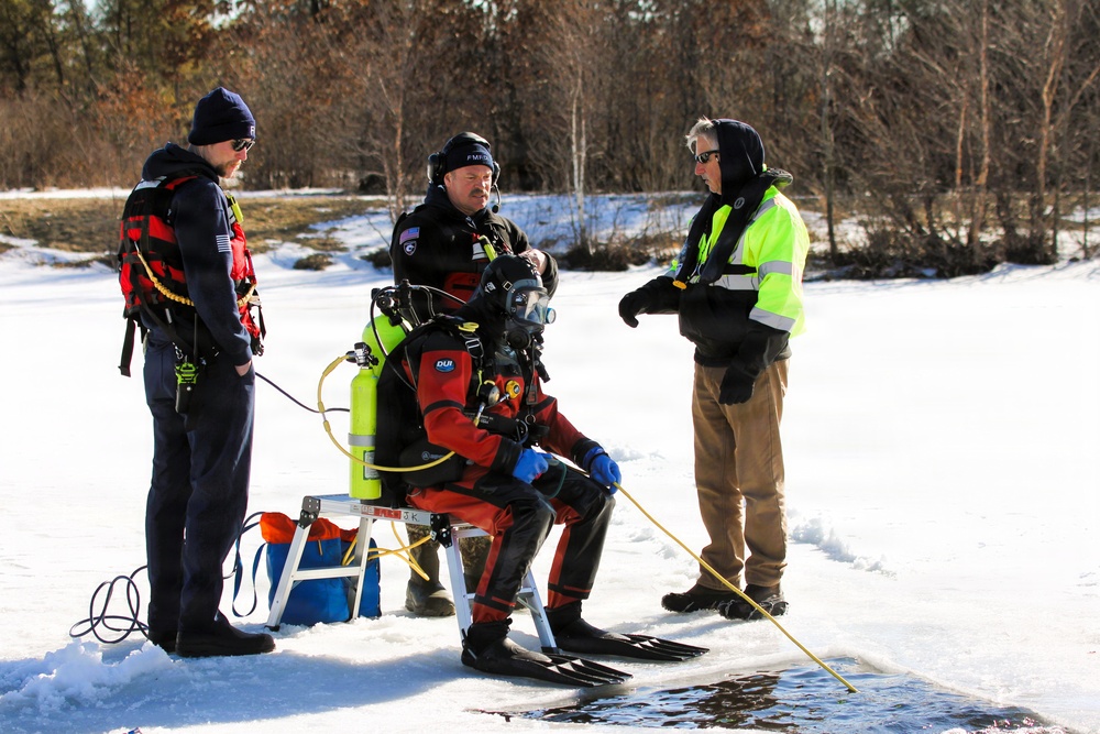 Fort McCoy firefighters practice diving under ice at post’s Big Sandy Lake during February 2026 training