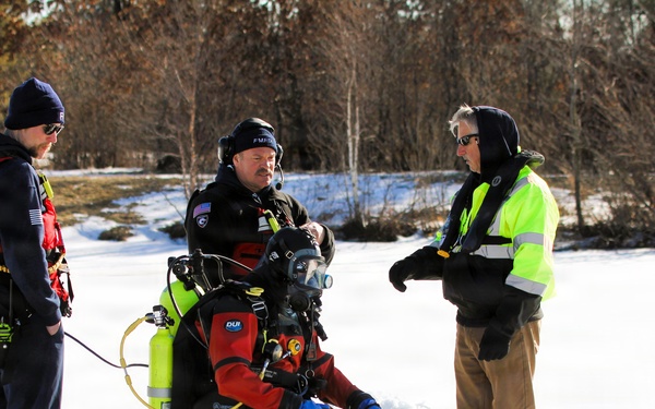 Fort McCoy firefighters practice diving under ice at post’s Big Sandy Lake during February 2026 training