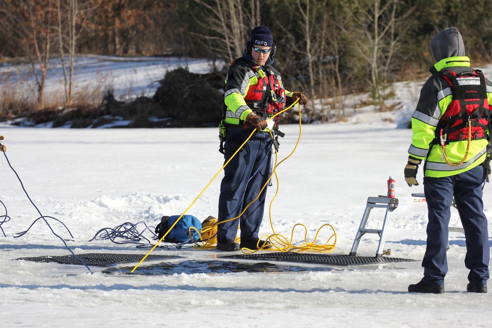 Fort McCoy firefighters practice diving under ice at post’s Big Sandy Lake during February 2026 training