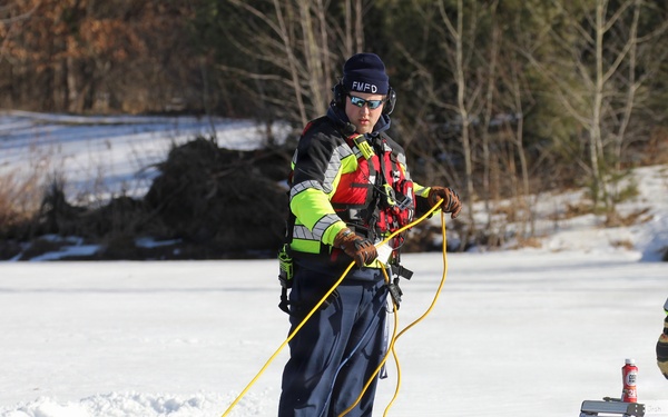 Fort McCoy firefighters practice diving under ice at post’s Big Sandy Lake during February 2026 training