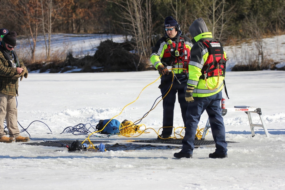 Fort McCoy firefighters practice diving under ice at post’s Big Sandy Lake during February 2026 training