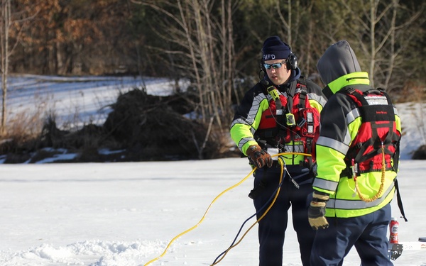 Fort McCoy firefighters practice diving under ice at post’s Big Sandy Lake during February 2026 training