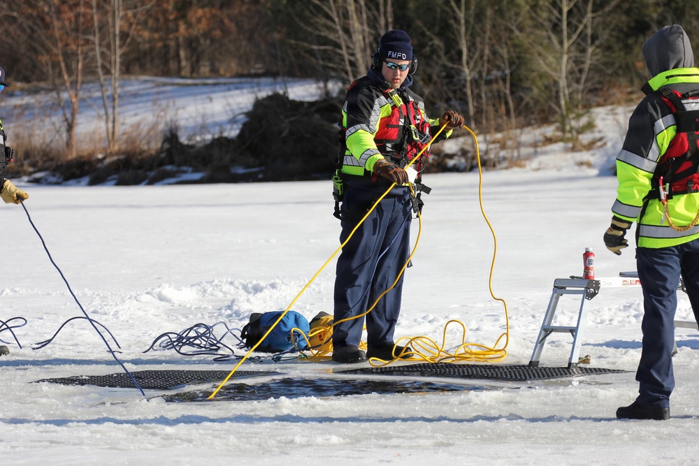 Fort McCoy firefighters practice diving under ice at post’s Big Sandy Lake during February 2026 training