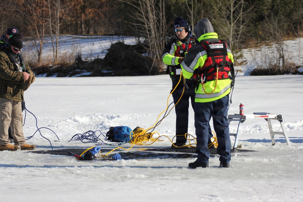 Fort McCoy firefighters practice diving under ice at post’s Big Sandy Lake during February 2026 training