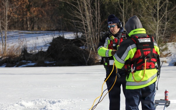 Fort McCoy firefighters practice diving under ice at post’s Big Sandy Lake during February 2026 training