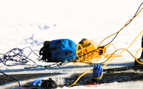Fort McCoy firefighters practice diving under ice at post’s Big Sandy Lake during February 2026 training